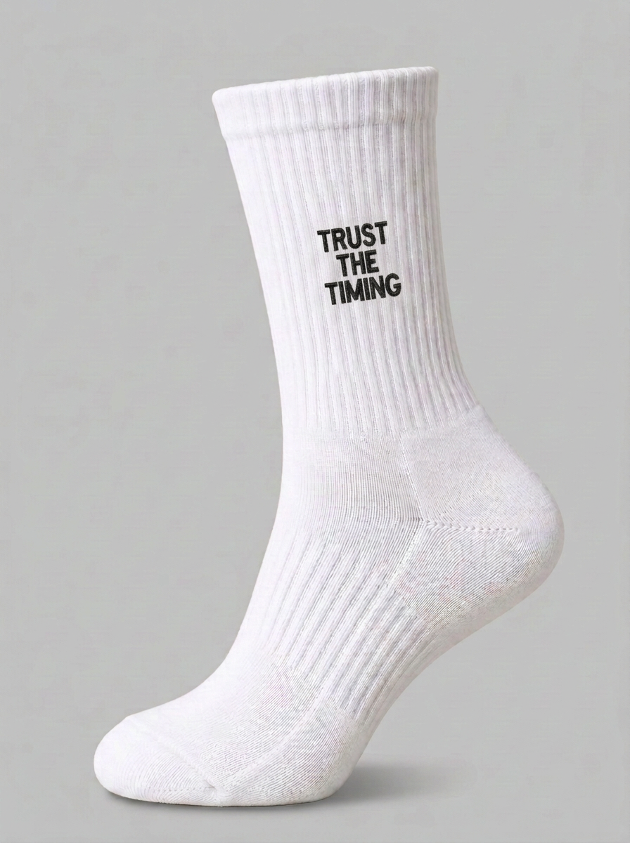 White ribbed crew sock with black TRUST THE TIMING embroidery.